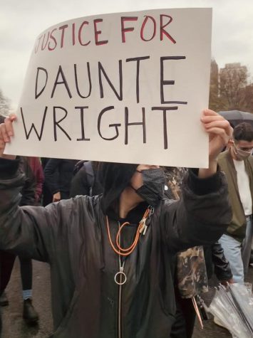 A photo from a protest for Daunte Wright.  The sign reads Justice for Daunte Wright.
