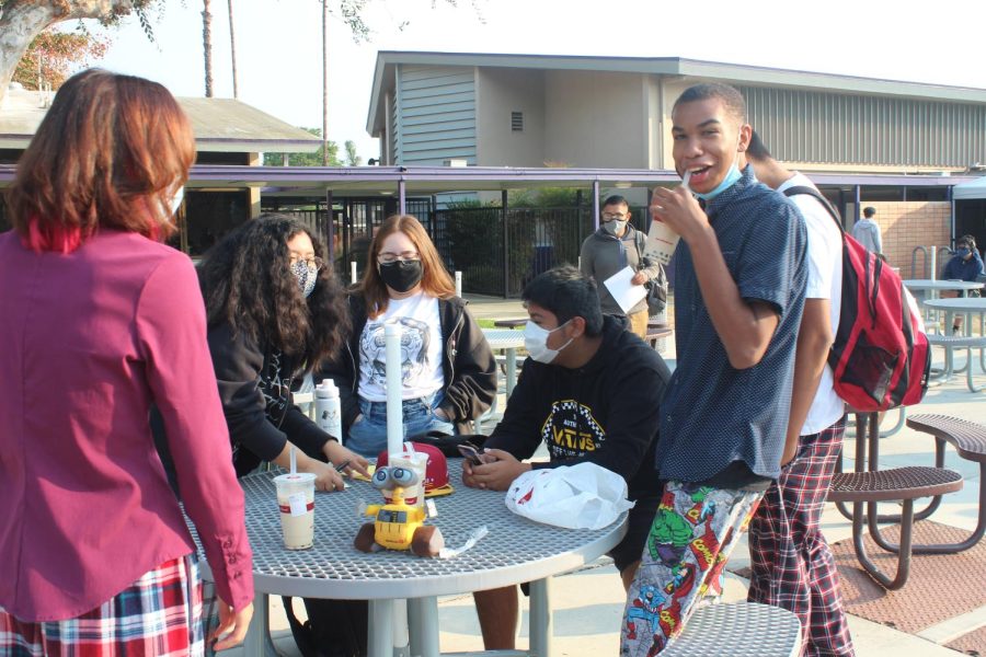 Students wearing pajamas on bottom and outwear clothing on top for Zoom day.