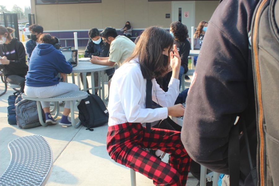 Student wearing pajamas on bottom and outwear on top for Zoom Day.