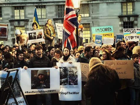 Protesters gather at a mass demonstration in London, England.