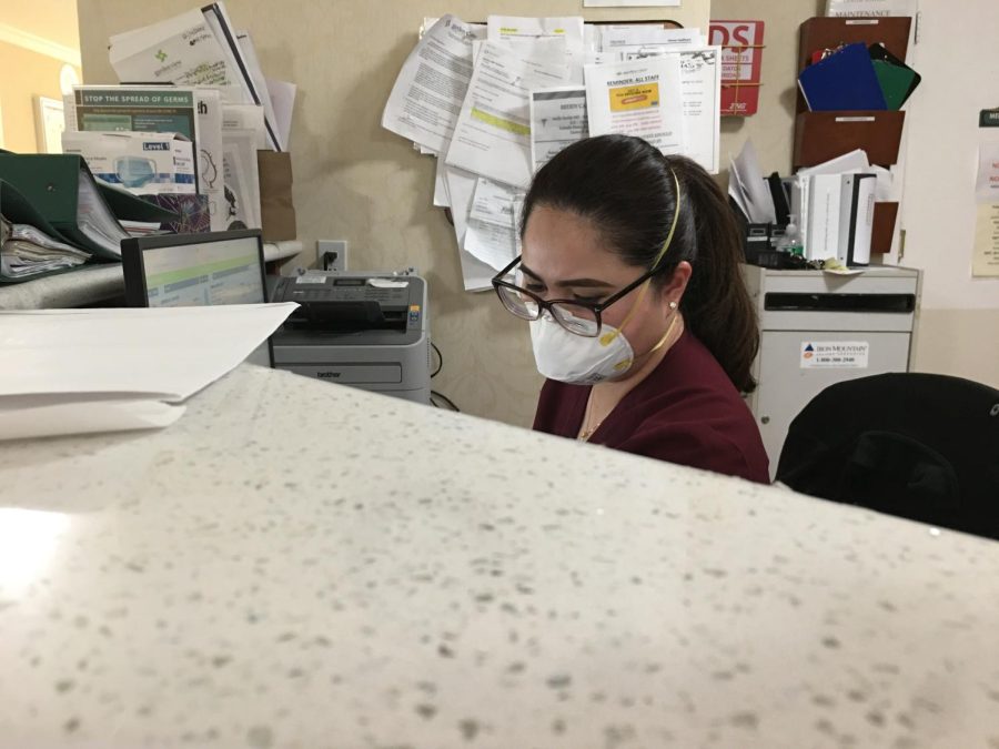 Kamille Trance, Registered Nurse, updating her patients chart in Center Station at Garden View Post-Acute Rehab. 