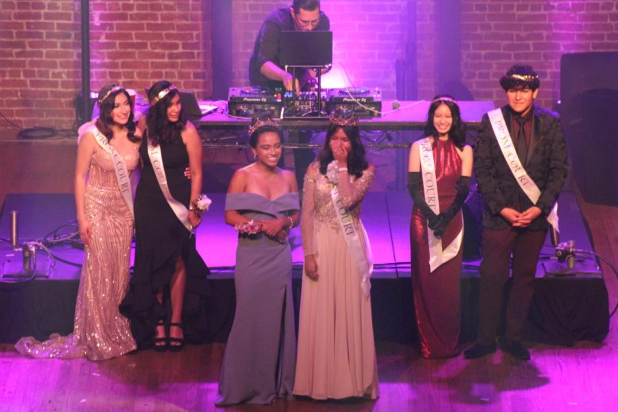 MECAs 2022 Royal Monarchs are applauded by the audience, as the prom courts, Zoe Burrola, Adriana Sanabria, Brianna Ha, and Arturo Escobar, look on. 