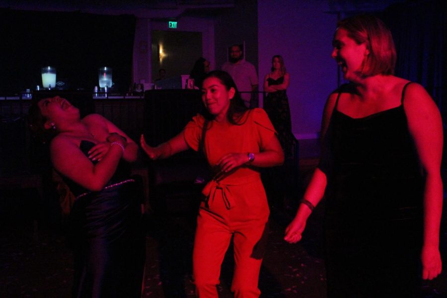 A wardrobe malfunction makes Cat Estrada laugh while dancing with teachers, Lauren Yao and Elizabeth Hoffman. 