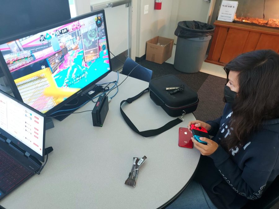 April Gonzalez plays Turf War during her teams Tuesday meeting.