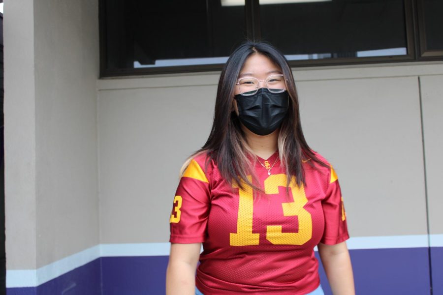 Katelynn Lee, freshmen, wears her  USC jersey to support her favorite sports team on Jersey Day during spirit week, here at MECA.