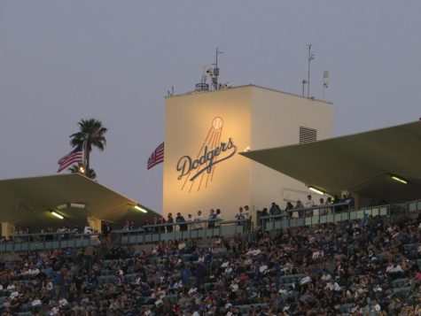 The Dodger logo being proudly illuminated at Dodgers Stadium. 