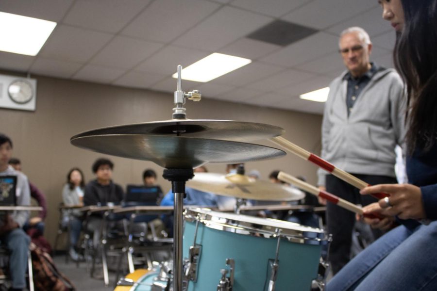 Nicole Li trying her hand at the drums. A fun activity for the last day of class, December 7th! 