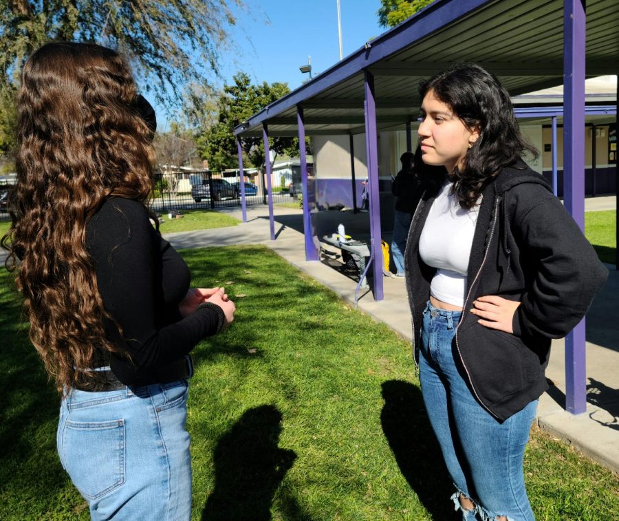 Samantha Soto (left) and Karen Sanchez (right) discuss the dress code.
