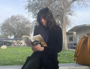 Alex reading The Poet X for her English 1 class.