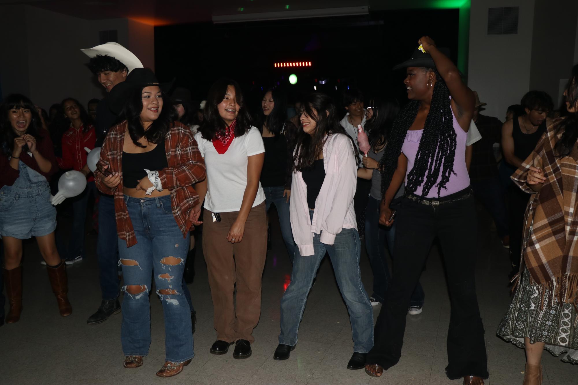 Nadia Taylor, Penelope Montes, Paola Aldana, and KaRisma Lockhart had a Grand Ole Time kicking their heels up at MECAs Wild West themed Back to School Dance! 