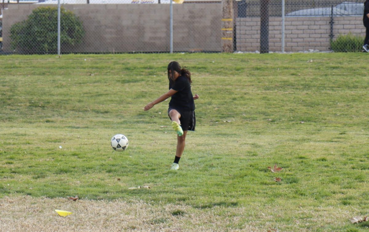 Freshman Kaitlyn Sanchez practicing her  moves for the soccer match against Coronado High School.