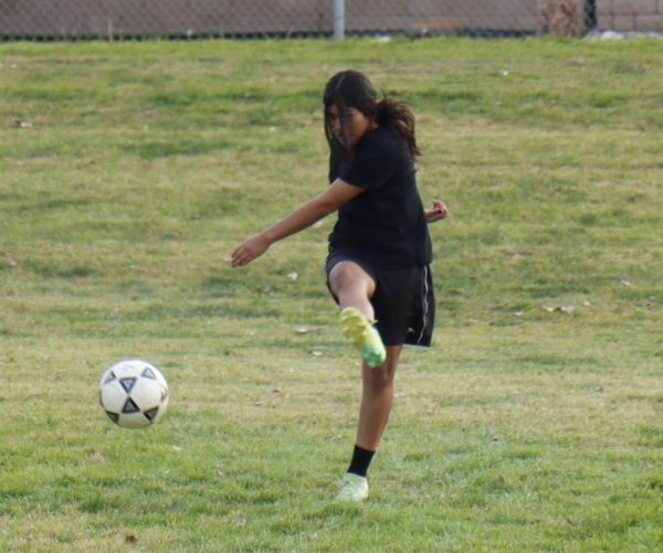Freshman Kaitlyn Sanchez practicing her  moves for the soccer match against Coronado High School.