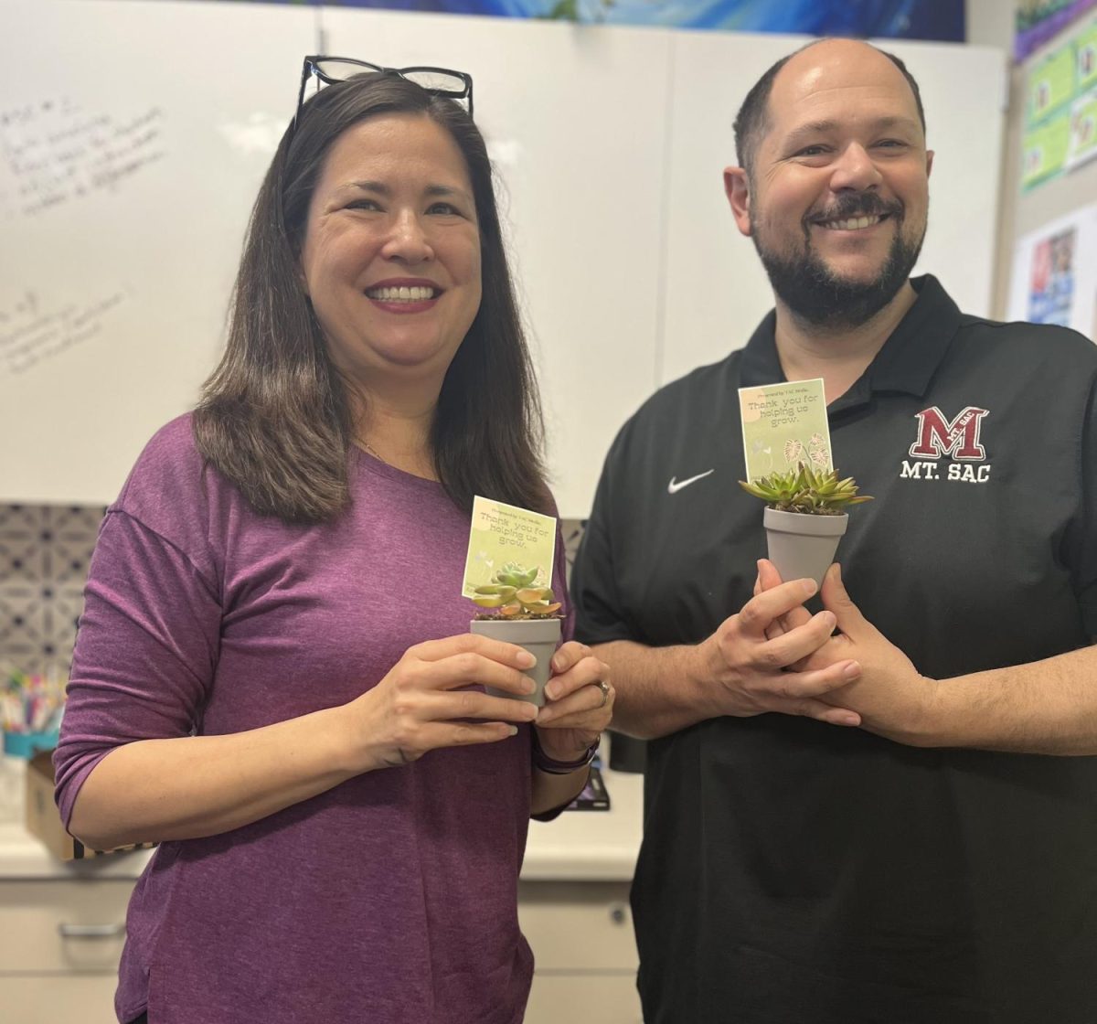 Tomoko Price, AP, and Dr. Ryan McDonnell, Principal, pose with their plants; as the heads of the school, Ms. Price and Dr. McDonnell work hard to make sure everyone on campus is safe, comfortable, and educated! 