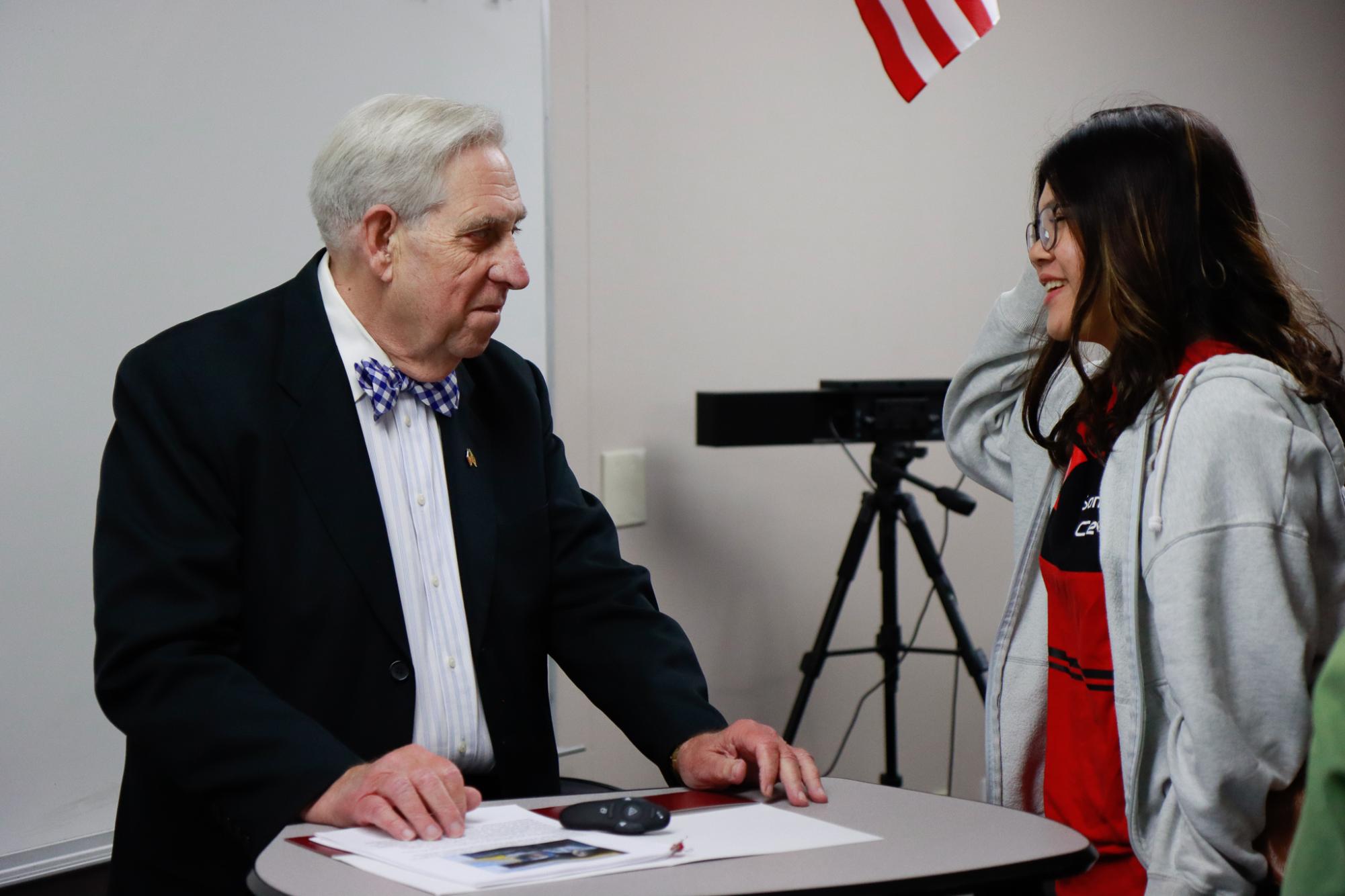 CEO, Drexel L. Smith, converses with sophomore Tara Phapornchai after the presentation.