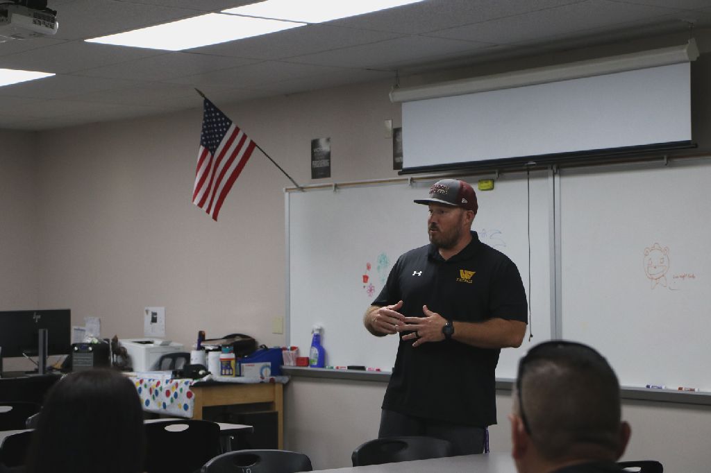 PE teacher Matt Johnson speaks to parents and students at back to school night, informing them on his class and future plans.