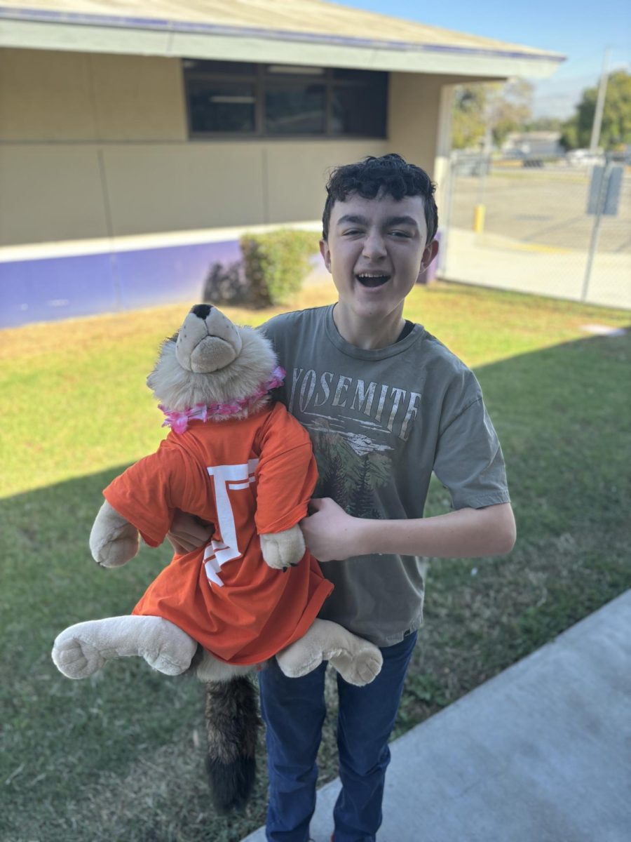 Former Gamma member Jared Jimenez (11) poses with his buddy Timmy who is repping Gamma with the now iconic orange Gamma shirt. "I liked the old houses because I knew them the best," says Jimenez.