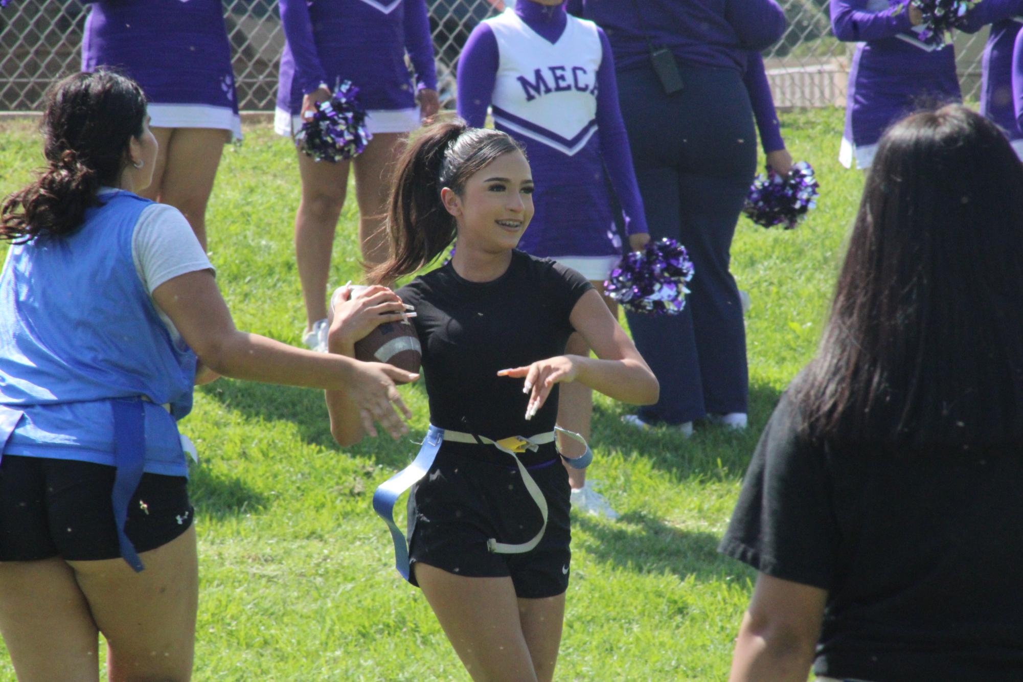 House Competition. Jocelyn Pena (9) playing for the blue team in the first house competition (Flag Football). Filled with joy and excitement, Jocelyn immediately changed from cheer uniform to sports wear to join in the competition.