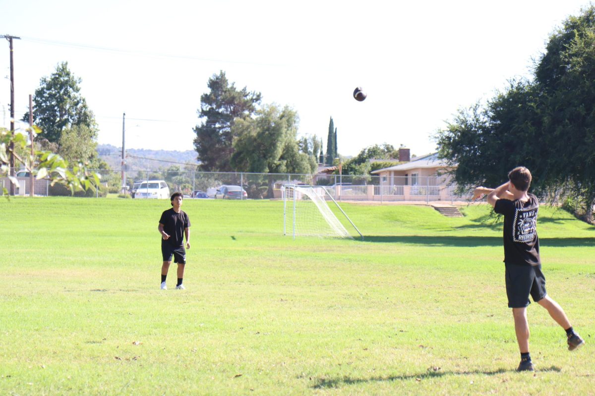 A great catch! Ninth grader Albert Martinez practices his skills of steadily catching a football. But it’s not as easy as it seems, you have to have good prejudgement, strength, and hand accuracy to successfully catch a football. 