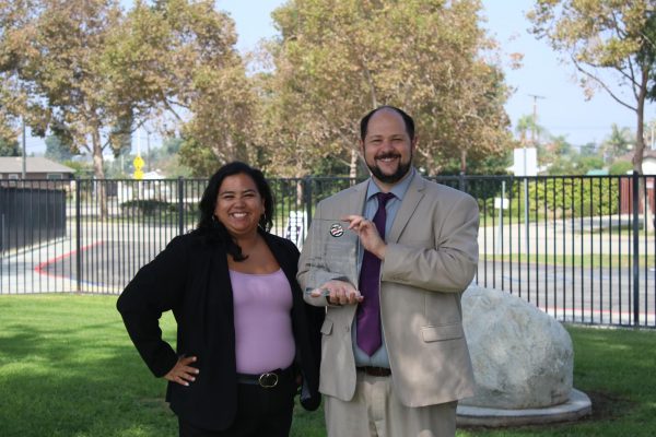 Dr. Katarina Garcia and Dr. Ryan McDonnell showing off MECA's California Distinguished School Award. 