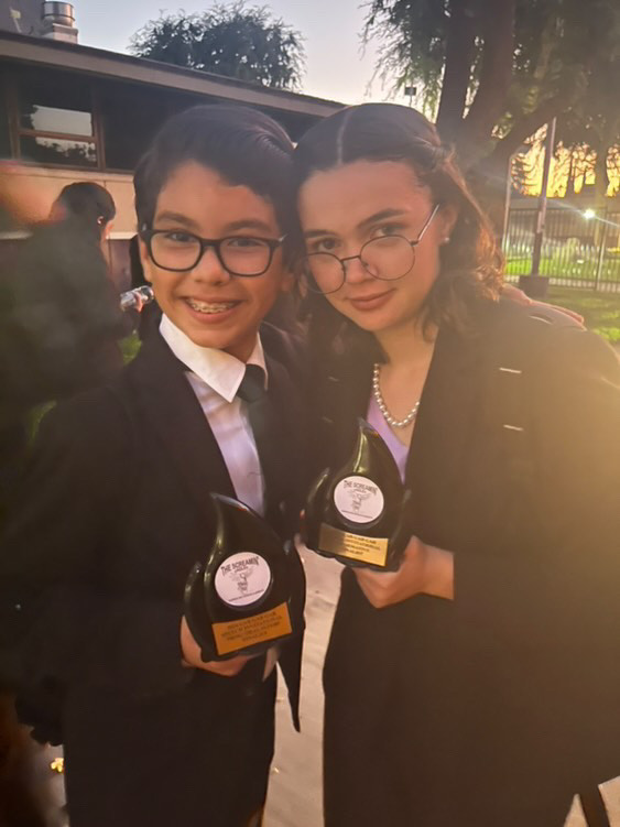 Competitors Annika Wotherspoon, a Senior at MECA (Right) and 8th grader Brayden Barraza- Rodriguez from Edgewood (Left) show off their awards.