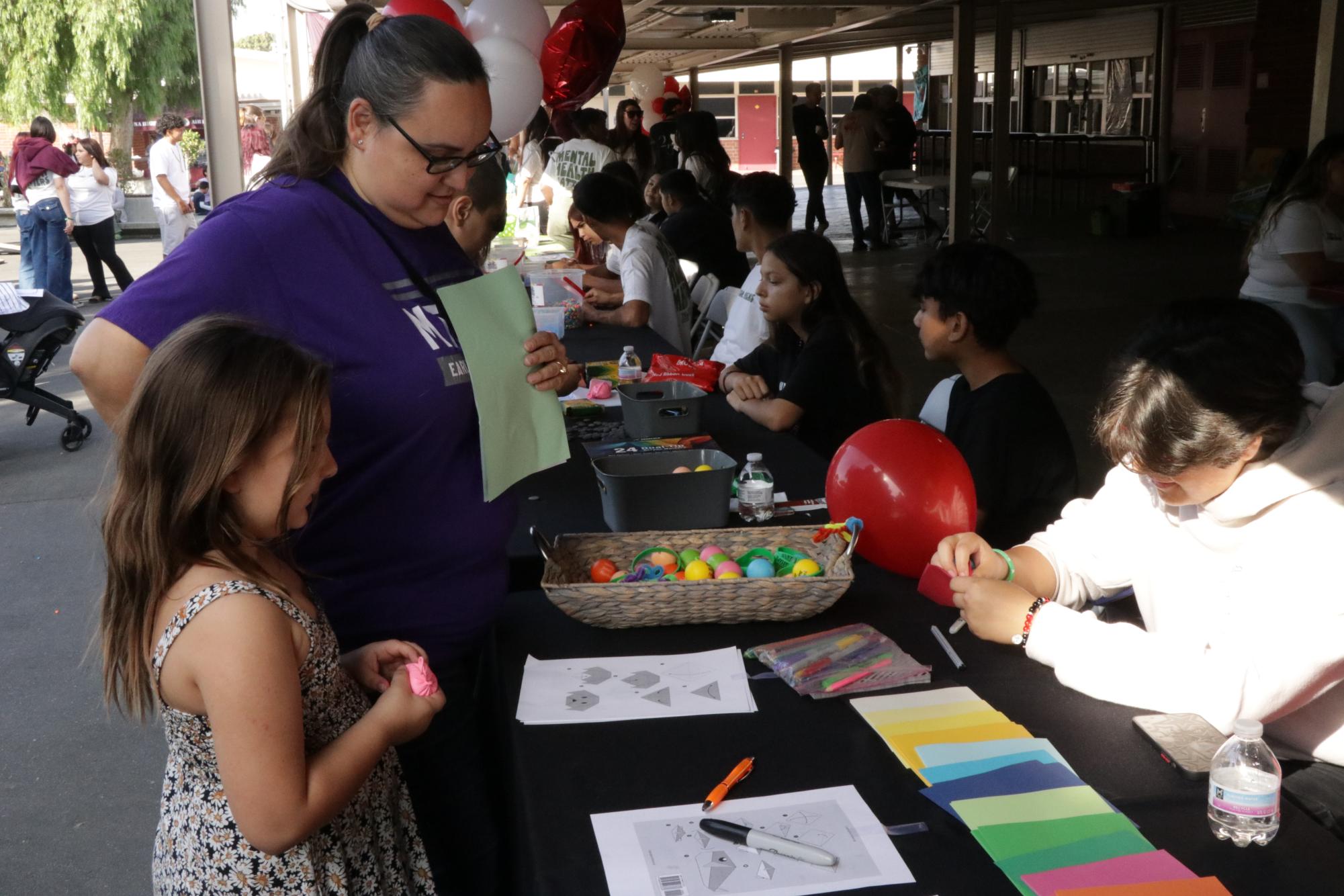 Parisa Rodriguez showed Hijar's daughter how to make an origami dog at the Red Ribbon Fair at West Covina High School on October 26th. Hijar would often attend school events outside of the school day to support the students of MECA.