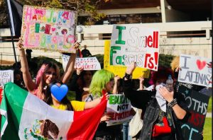 West Covina students show off their signs to cars driving by West Covina City Hall. Several students had Mexican flags and signs that expressed love and support specifically for Mexican immigrants who have been spoken about by President Trump.