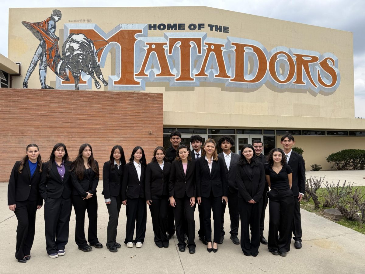 Academic Decathlon proudly standing in front of San Gabriel High School after a competition. (From Left to right: Emily Lassiter, Dulce Chacon, Mia Andrade, Katelyn Chung, Karren Zhuang, Lauryn Marin, Tepochtli Cervantes, Alexandra Davalos, Damian Mejia, Tara Phapornchai, Andres Bocardo, Evangelina Esparza, Samuel Amador, Isabella Jarquin, Alexander Xu)