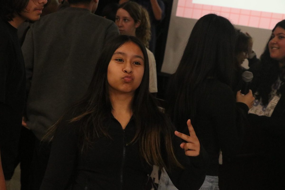 Lily Erazo, an energetic freshman at MECA, posing for a picture at the Valentine's themed house competition in the MPR.