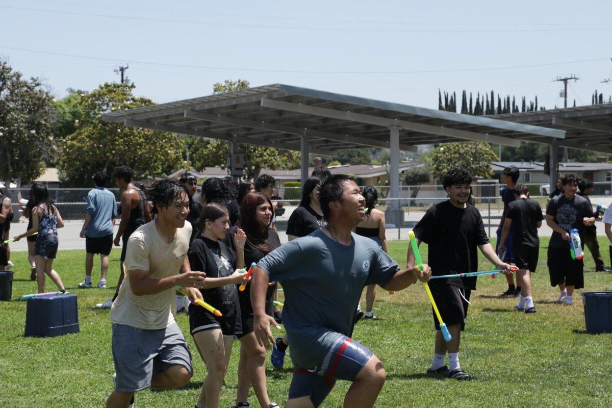 Sophomores En Hao and Tao Zhu chasing each other and having fun during summer social