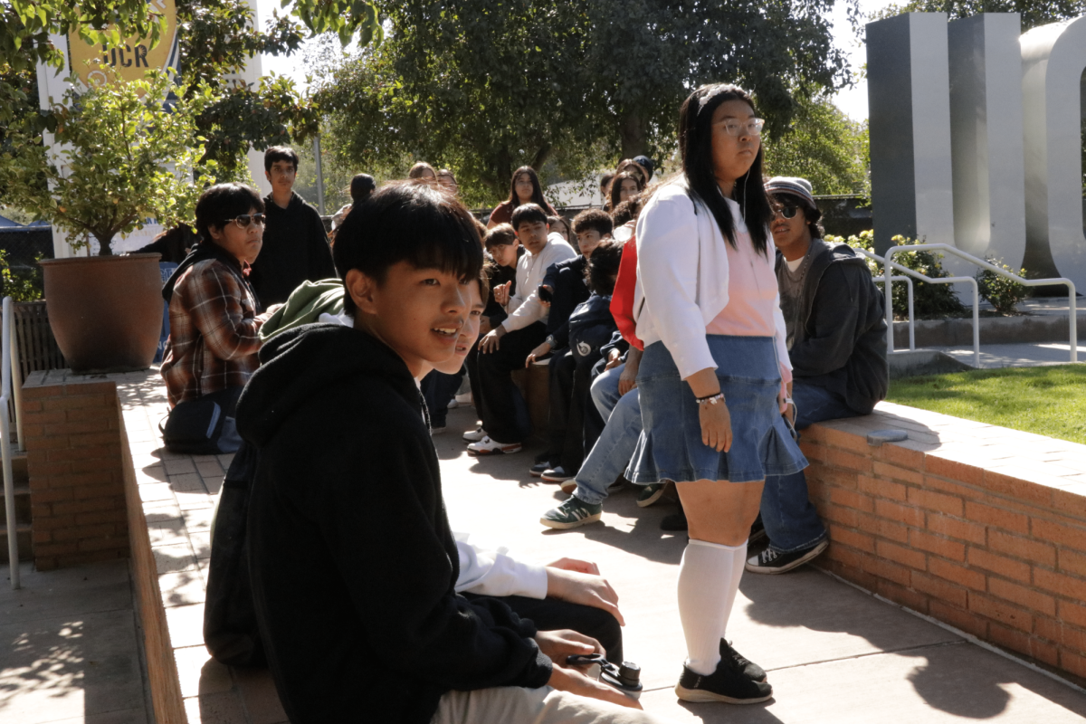 Ryan Huynh (9th) and Emily Du (9th) looking over towards the teachers during the UCR freshman field trip.