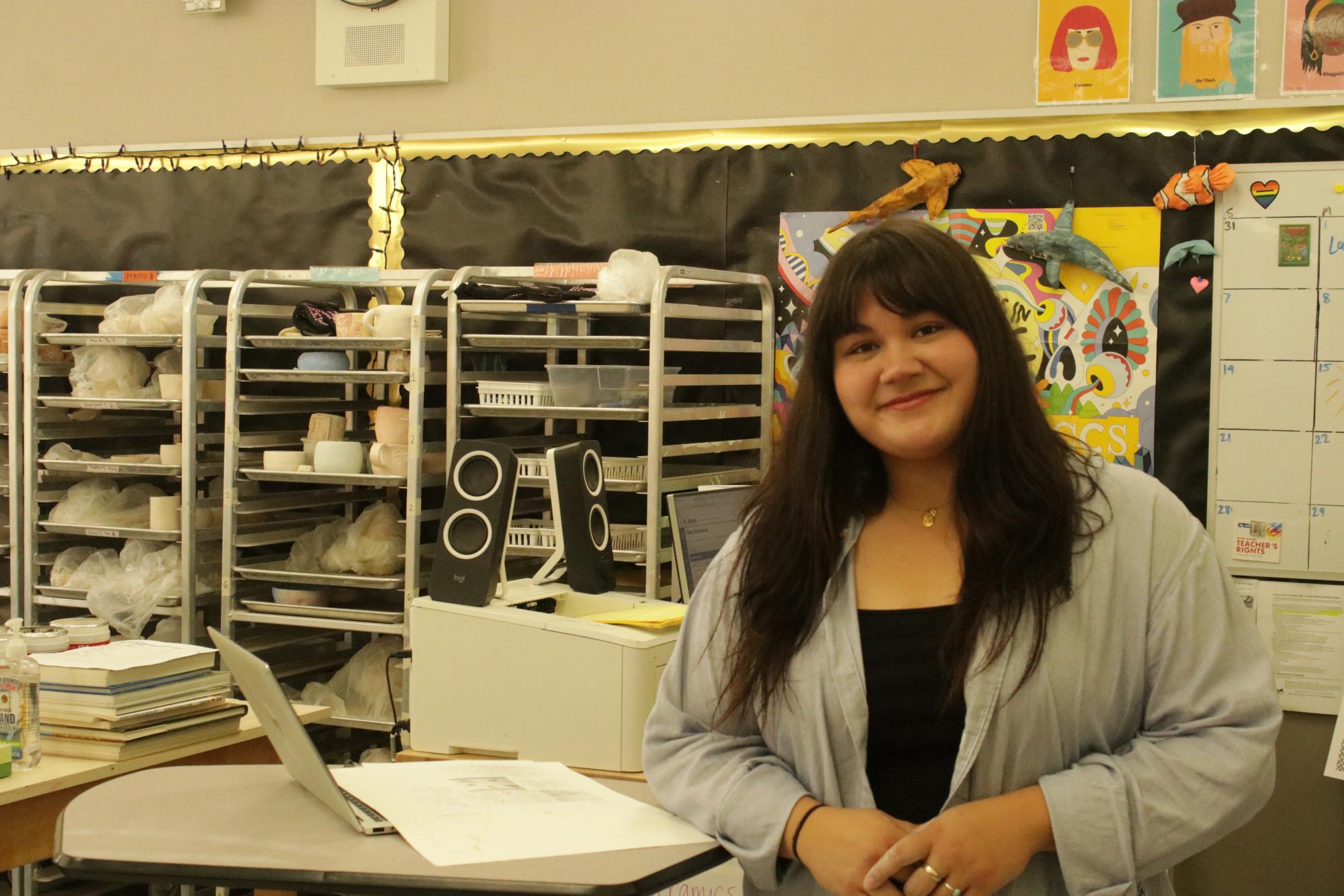 The new art teacher, Samantha Lujan poses for a photo in her classroom.