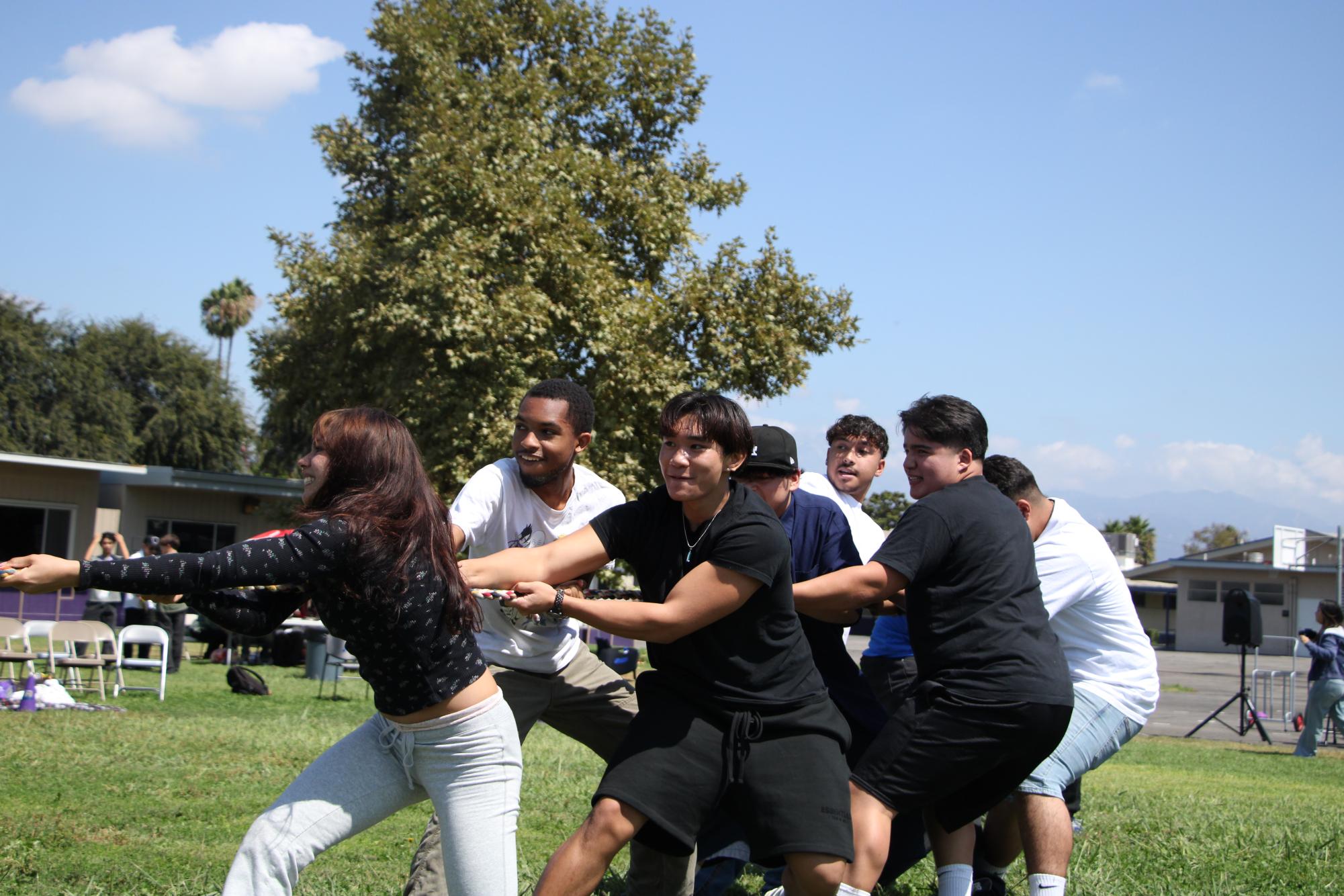 The seniors struggle in a game of tug of war during the September class competition against the juniors.