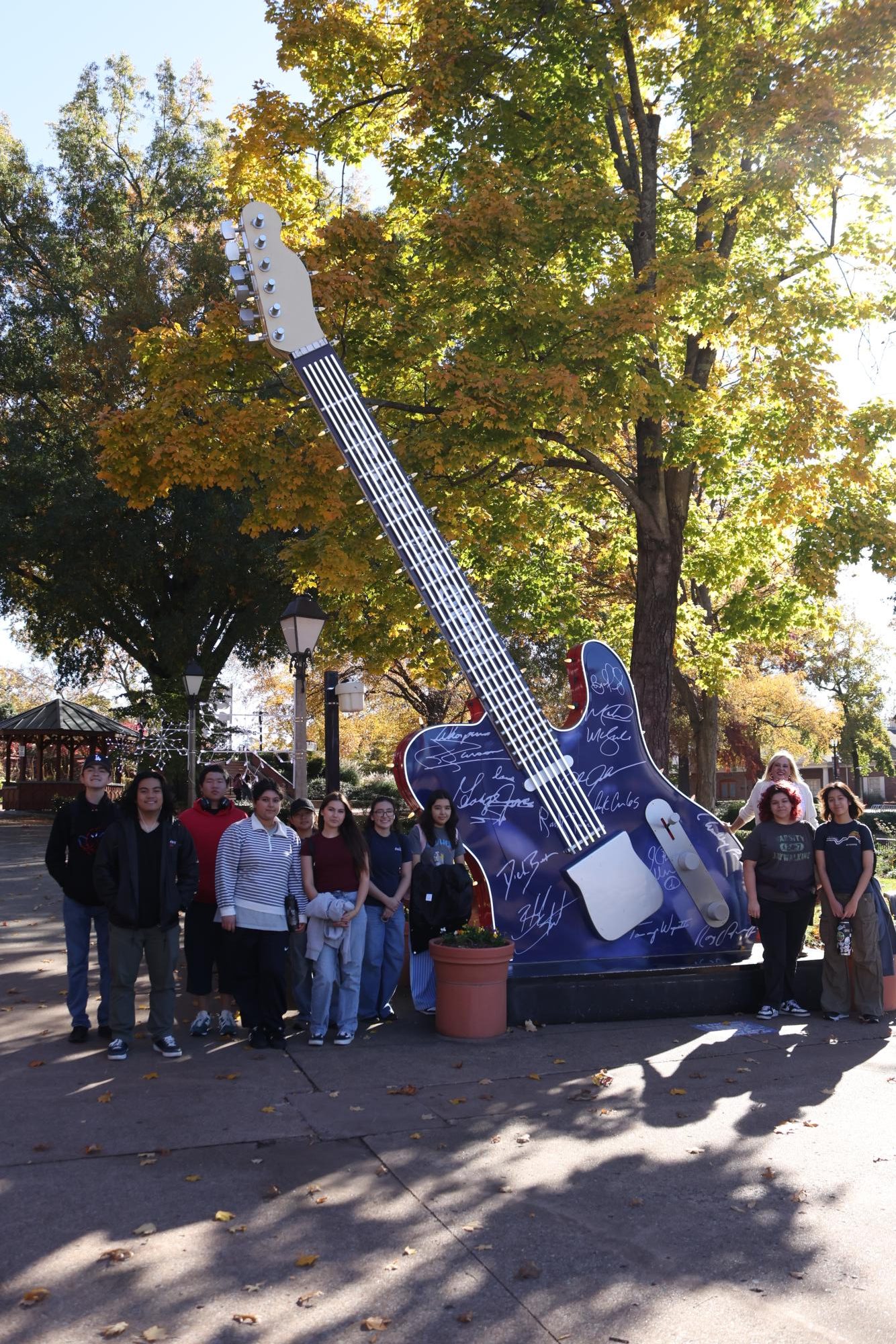 A giant guitar stands outside the Opry with music stars signatures, including Dolly Parton's! 