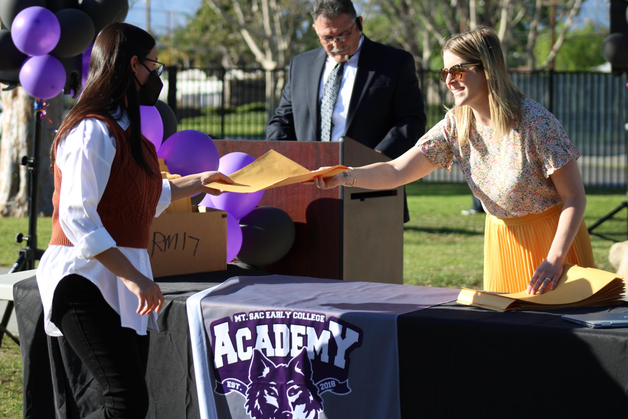 Claire Contreras, counselor, passes out an award at the Spring Award Ceremony of 2022; this was the second to last award ceremony hosted at MECA. “I felt excited and honored to be able to share in that moment of recognition with our students. It was a beautiful day out and I felt happy that students were celebrated for their hard work and dedication to their studies,” Contreras said.