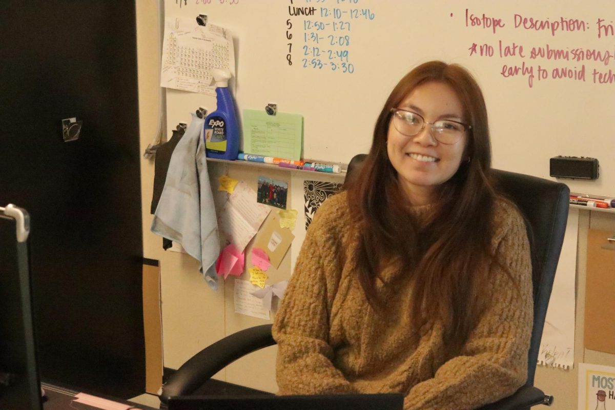 Ms Banh currently teaching her second period anatomy class. She smiles for the camera.