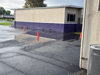 Near the boys bathroom and the basketball courts, the area always floods completely with water.