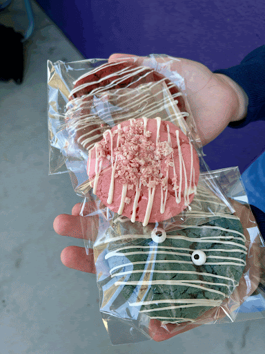 Alemi showing off her Strawberry Crunch, Cookie Monster, and Red Velvet cookies.