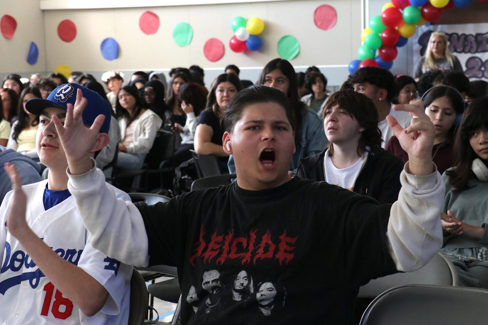 Senior Vincent Hernandez cheering with the crowd during the Renaissance Rally!