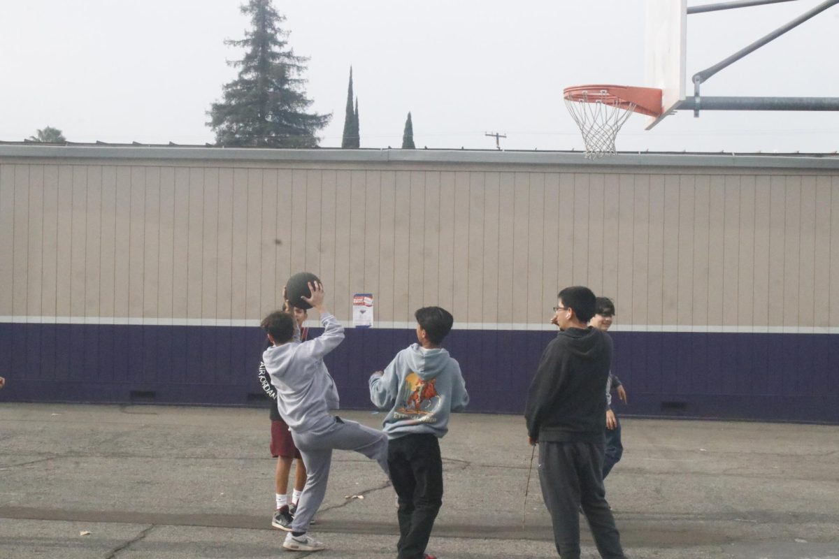 Freshman Jacob blechman, Anthony Gandara III, Trinidad Gonzalez, competing on a basketball games.