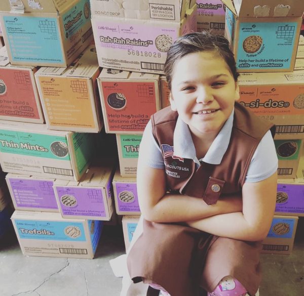 A photo from 2016: I was a Brownie getting ready for Cookie season. At this age, I was easily able to sell cookies at booths.