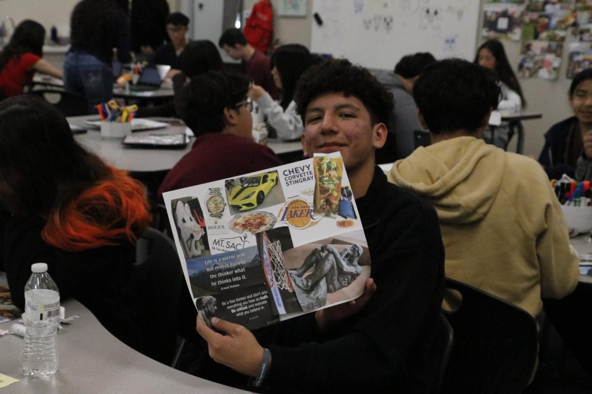 Nathan Vazquez showing his finished vision board from CCR. 