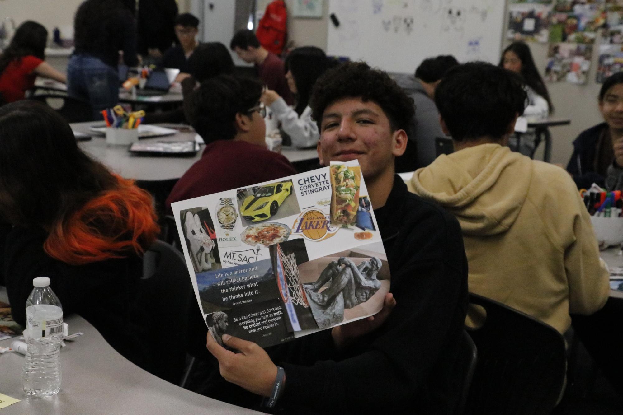 Nathan Vazquez showing his finished vision board from CCR. 
