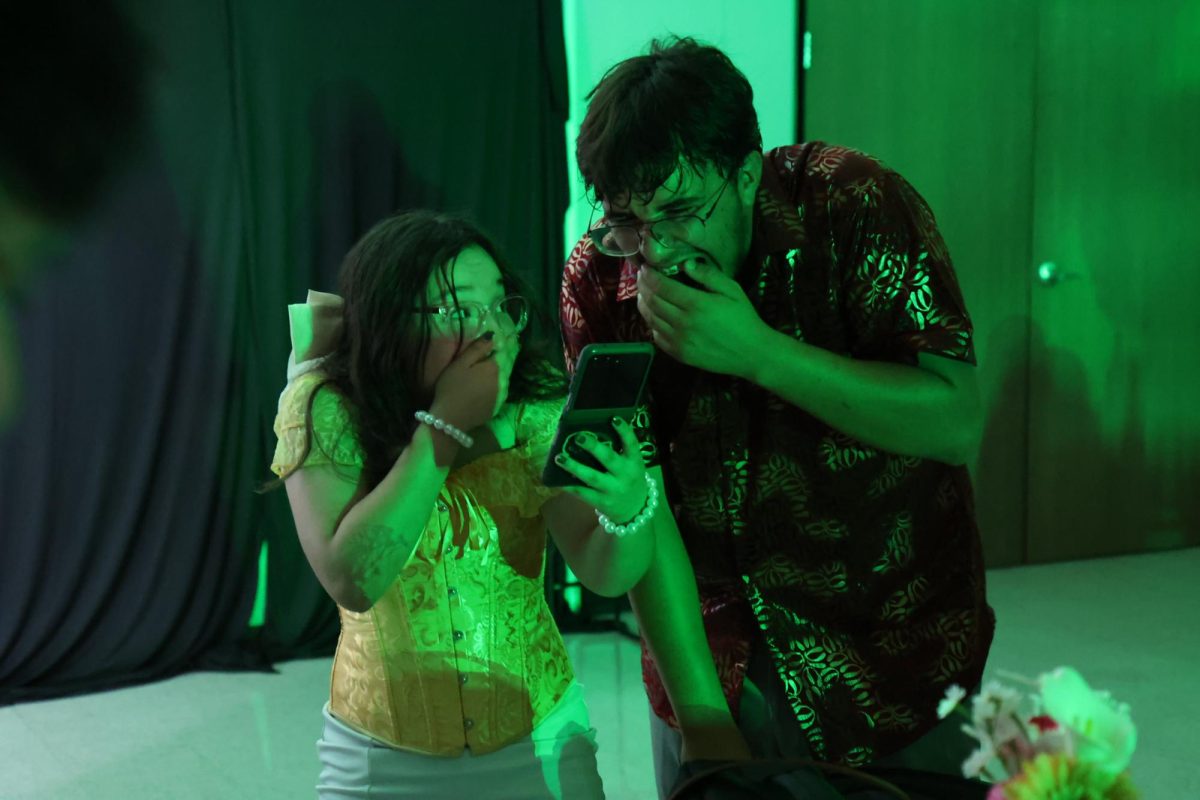 Sophomore Juan Alarcon expresses a shocked and amused reaction to something on his friend, Jasmine's phone!