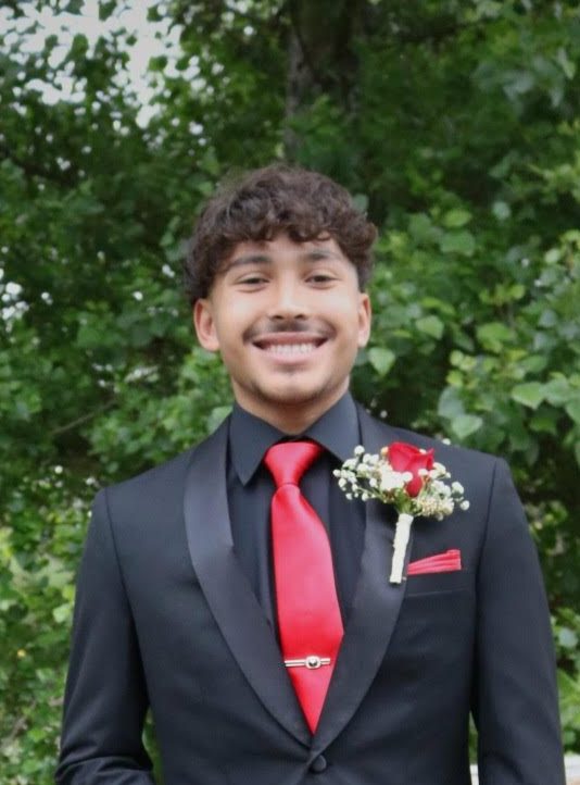 Anthony Reyes (12) posing for a professional photoshoot before his junior year of prom.