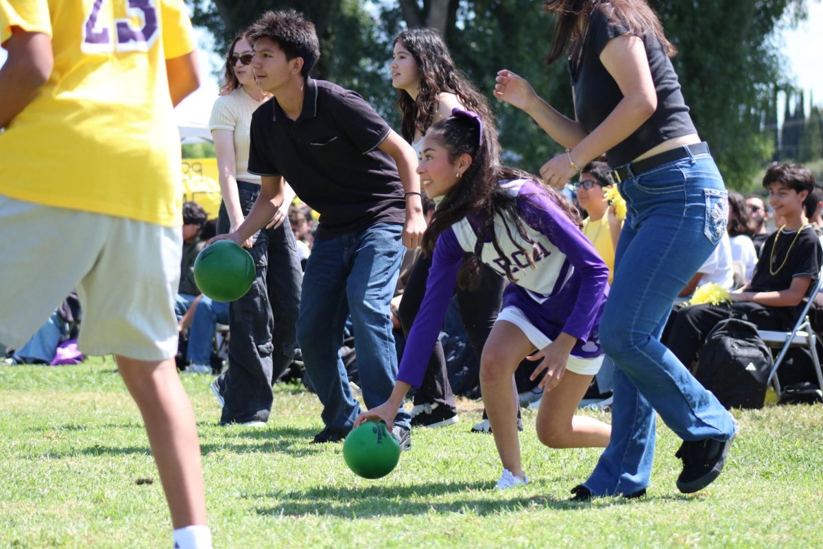 Valentina plays dodgeball in a class competition.