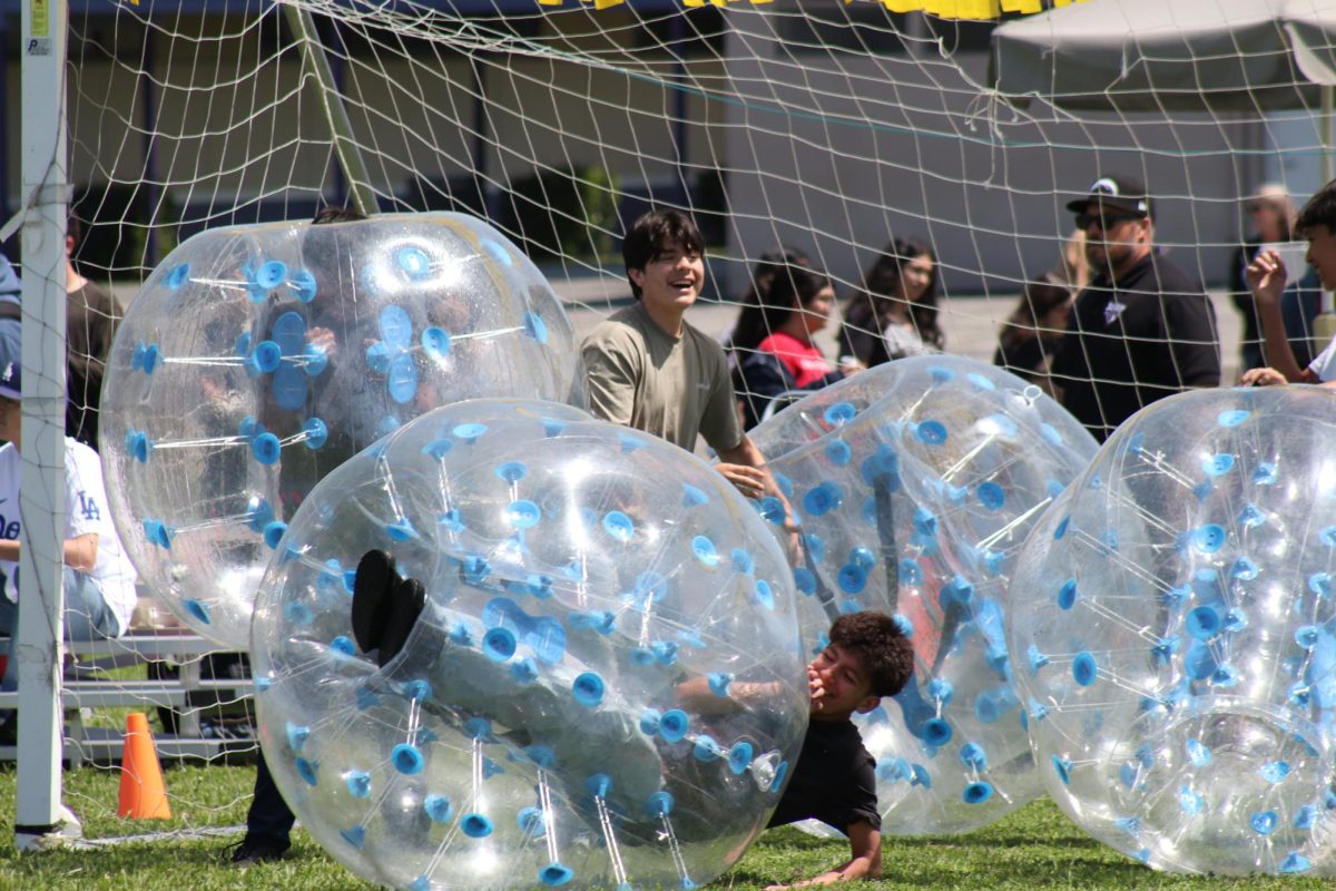 Trinidad Gonzalez and Nathan Vazquez (9) laugh while protecting the ninth graders' goal.