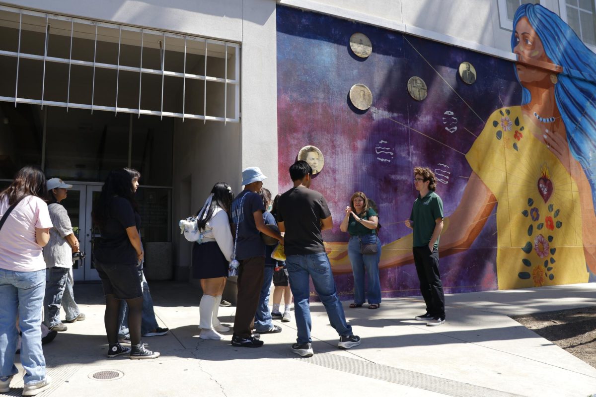 While walking by the art center, one of the tour guides of ULV explains how their school is very connected to the arts. One of the examples the guide explained was the memorial that was painted behind him.